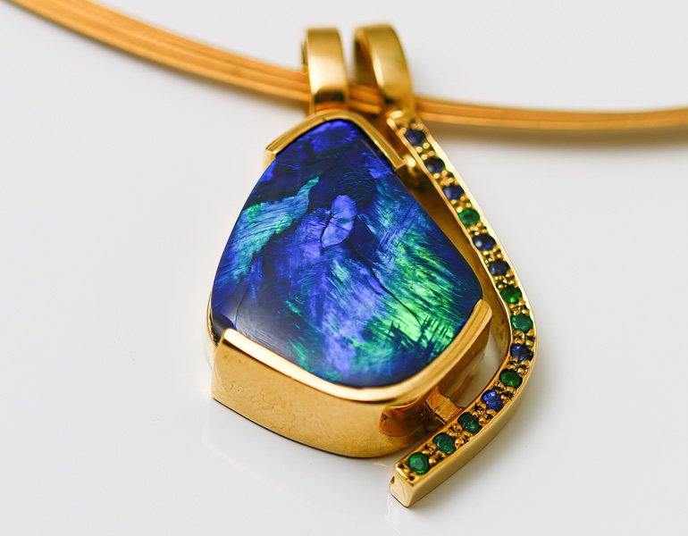 solid 18 karat yellow gold australian black opal, sapphire and emerald pendant