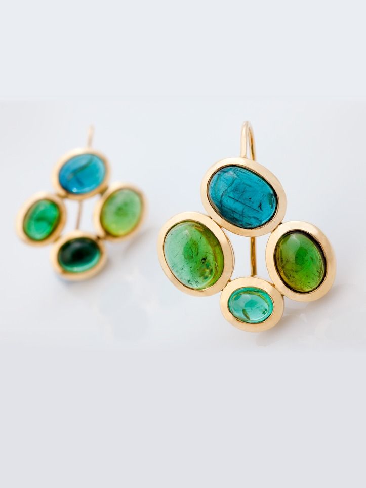 A pair of yellow gold drop earrings, each a cluster of four green and blue tourmaline cabochons